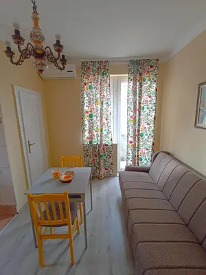 a living room with a couch and a table at Fontana in Kruševac