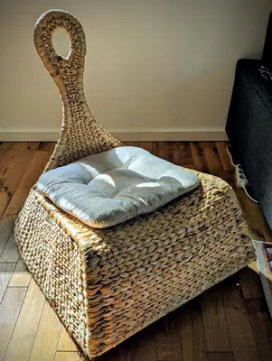 a wicker chair sitting in a living room at Kopaonička priča in Kopaonik