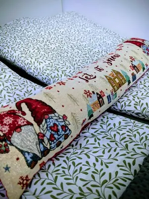 a close up of two pillows on a bed at Kopaonička priča in Kopaonik