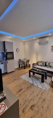 a living room with a couch and a table at Apartman Magic house in Kruševac
