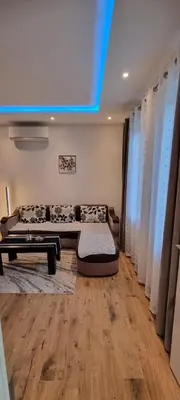 a living room with a couch and a table at Apartman Magic house in Kruševac