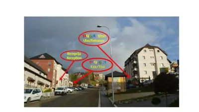 a map of a street with buildings and cars at Apartman S32 Milmari in Raška