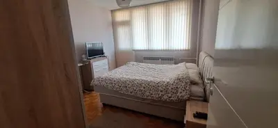 a small bedroom with a bed and a window at Centar ljubavi in Kruševac