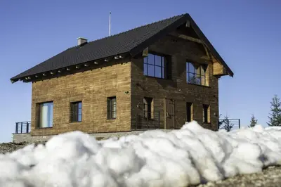 a house on top of a pile of snow at Chalet 1600 Kopaonik in Kopaonik