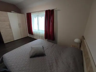 a bedroom with a bed with a pillow on it at Apartman K25 Milmari in Kopaonik