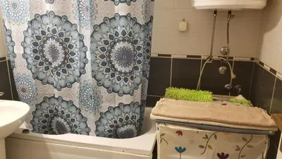 a bathroom with a toilet and a shower curtain at Pufen Apartments - Nis in Niš