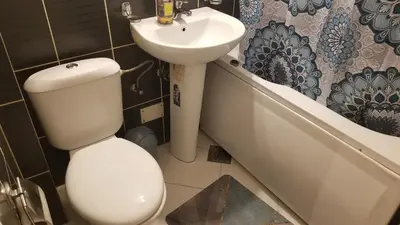 a bathroom with a toilet and a sink at Pufen Apartments - Nis in Niš