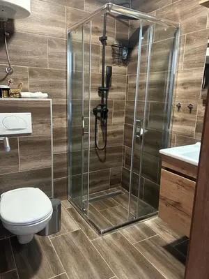 a bathroom with a shower and a toilet at Apartman Snow Heaven Kopaonik in Kopaonik