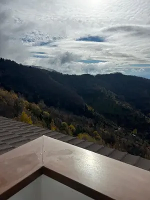 a view of the mountains from the roof of a house at Apartman Snow Heaven Kopaonik in Kopaonik