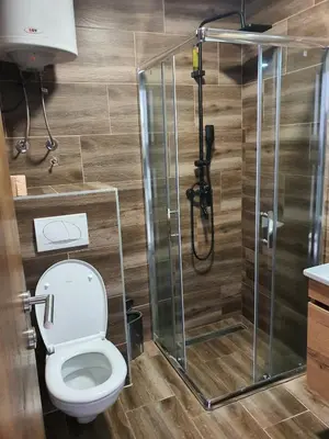 a bathroom with a toilet and a shower at Apartman Snow Heaven Kopaonik in Kopaonik
