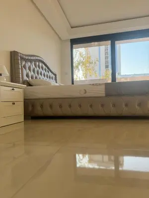 a bedroom with a large bed and a window at Best Deal Suite in Niš