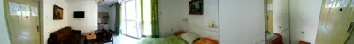 a room with a hallway with a window and a staircase at Apartments Nebojša in Soko Banja