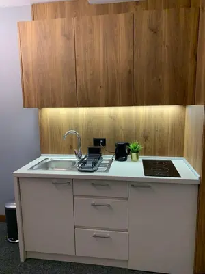 a kitchen with a sink and a counter top at Apartman Glečer Vila Bela Reka in Brzeće