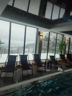 a group of chairs sitting next to a swimming pool at Milmari kop in Raška