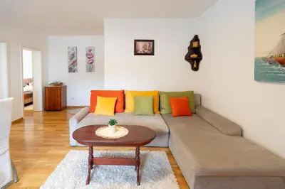a living room with a couch and a table at CVETIĆ apartman in Zaječar