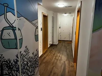 a hallway with a painting on the wall at Z3 Studio in Kopaonik