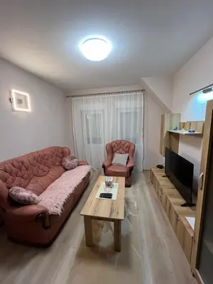 a living room with a couch and a coffee table at Apartman KVINS 1 in Kruševac