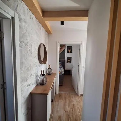 a hallway of a home with a counter and a mirror at Hera Kopaonik in Kopaonik