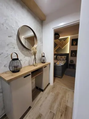 a dressing room with a vanity and a mirror at Hera Kopaonik in Kopaonik