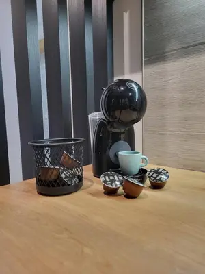 a coffee maker sitting on top of a wooden table at Hera Kopaonik in Kopaonik