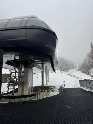 a boat sitting on top of a bus stop in the snow at Vila Aurora , 50m od Gondole Brzece in Brzeće