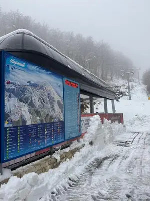 a sign in the snow next to a train station at Vila Aurora , 50m od Gondole Brzece in Brzeće