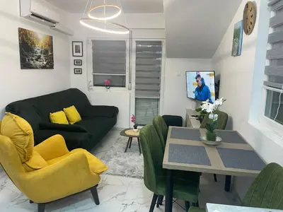 a living room with a couch and a table at Četiri dragulja in Soko Banja