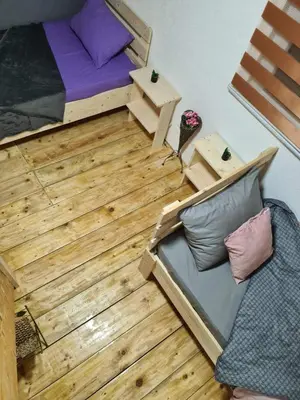 a room with a bunk bed and a couch at Šumska vila Gašić in Kopaonik