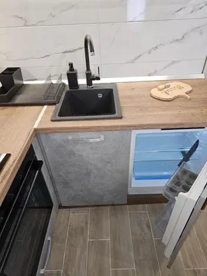 a kitchen with a sink and a counter top at Friends Apartmani - Broj 2 in Raška