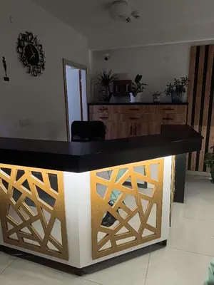 a kitchen island with a black and white counter top at Sunčana planina apartman 104 in Kopaonik