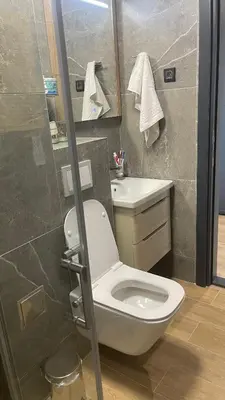a bathroom with a toilet and a sink and a shower at Apartman Lawa Kopaonik in Kopaonik