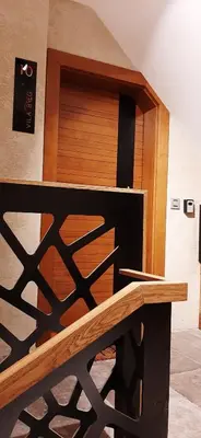 a wooden counter with a wooden shelf in a room at Vila Breg Kopaonik Centar in Kopaonik