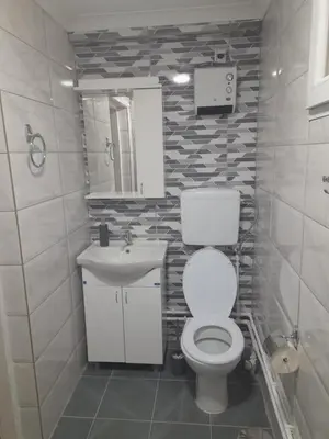 a bathroom with a toilet and a sink at Apartman vikend kuca Hs in Pirot