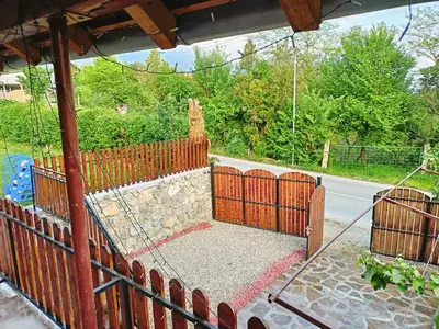 a fence with a swing in a yard at Apartman vikend kuca Hs in Pirot
