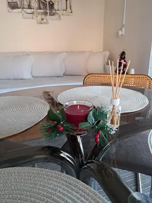 a table with christmas decorations on top of it at Apartman Dream M Zaječar in Zaječar