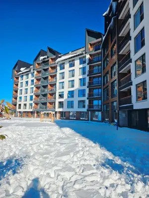 a view of the apartment buildings from the beach at Residence Hill Lux in Kopaonik