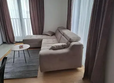 a living room with a couch and a table at Winter House in Kopaonik
