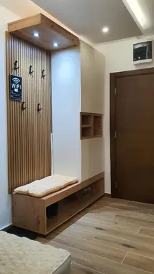 a room with a bench in front of a door at Apartmani Kasandra Wellness Spa A203 President Kop Kopaonik in Kopaonik