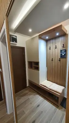 a room with a hallway with a door and a room with a door at Apartmani Kasandra Wellness Spa A203 President Kop Kopaonik in Kopaonik