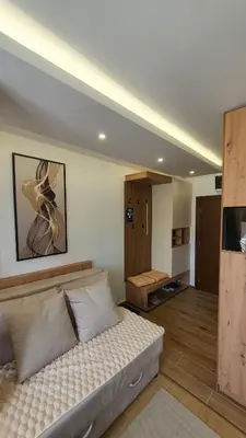 a bedroom with a bed in a room at Apartmani Kasandra Wellness Spa A203 President Kop Kopaonik in Kopaonik
