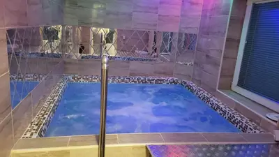 a bath tub with a sky in it at Lily Apartmani Brzece in Brzeće