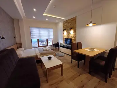 a living room with a couch and a table at View N52A in Kopaonik