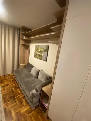 a living room with a couch in a room at Apartman Marta - Kraljevi Čardaci in Kopaonik