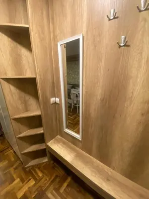 a room with a mirror and a wooden wall at Apartman Marta - Kraljevi Čardaci in Kopaonik