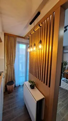 a living room with a tv and a table at studio apartman Najdanović CENTAR in Vrnjačka Banja