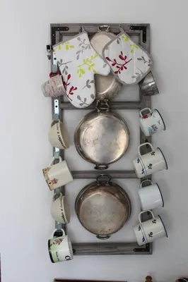 a bunch of dishes hanging on a wall at Panorama house Goč in Goč