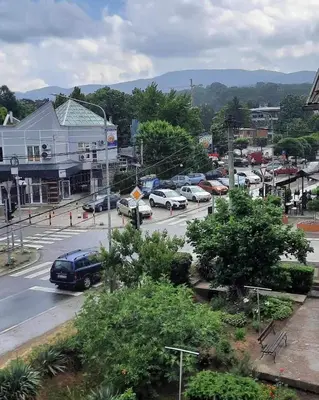 a city with cars parked in a parking lot at Apartman Tiki R Vrnjacka Banja in Vrnjačka Banja