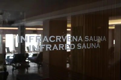 a glass window with the words interpoloperative sauna inamed saanu at Silvani Kop NLux67, Milmari Apartments & Spa in Kopaonik