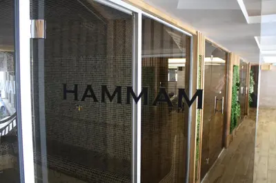 a glass window with the words humanity written on it at Silvani Kop NLux67, Milmari Apartments & Spa in Kopaonik