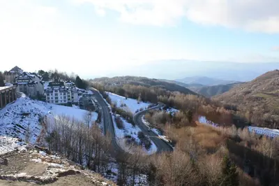 arial view of a road in the mountains with snow at Silvani Kop NLux67, Milmari Apartments & Spa in Kopaonik